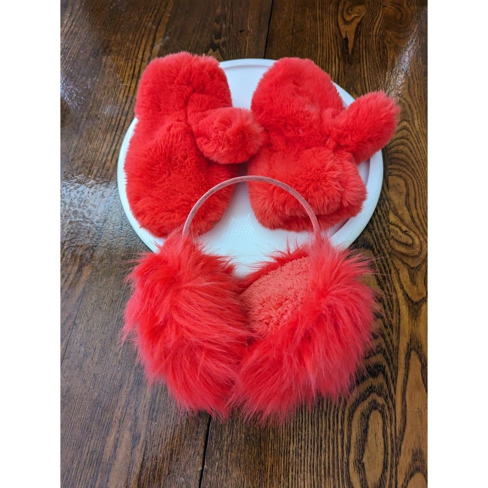 Girls red fluffy mittens and earmuffs